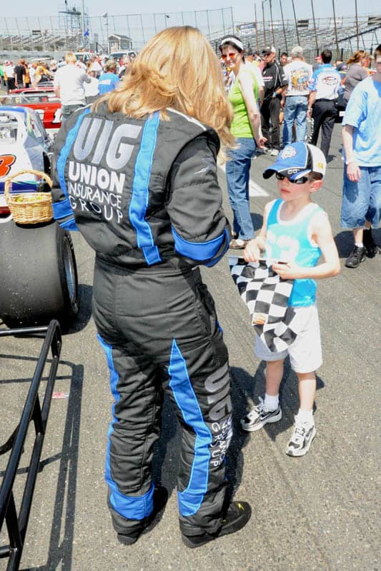 Renee signs autographs for a young fan during Stafford's annual Spring Sizzler event. Howie Hodge Photo.